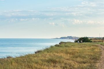 Fototapeta na wymiar cliff seascape, resort town on the horizon