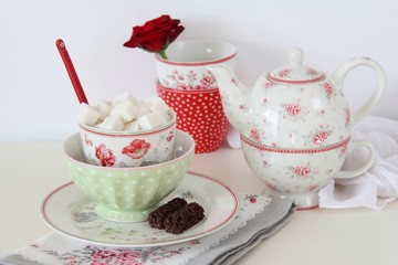 Tea set on a white table.
