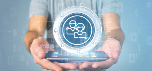 Businessman holding a social media network contact icon