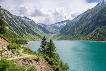 Fototapeta na wymiar Scenic view of a blue colored glacier lake in the Alps, Europe