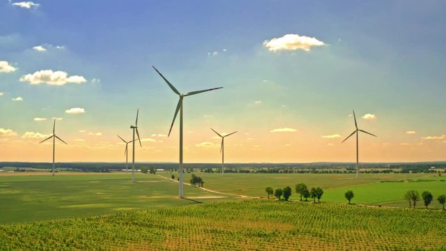 Big wind turbines in sunny summer Poland, aerial view