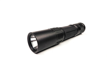 black long flashlight isolated on white background.