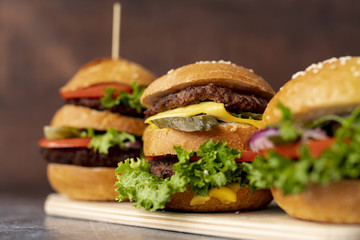 Close-up hamburgers on cutting board
