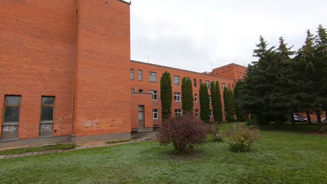 Slow Motion Of Soviet-Era Red Brick Hospital Building.