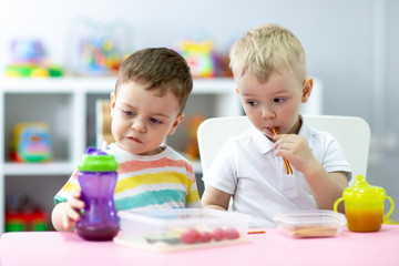 Kids have pause to eat in kindergarten or daycare