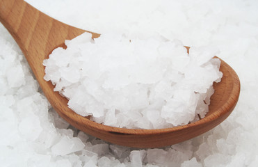 Coarse  sea salt wih wooden spoon