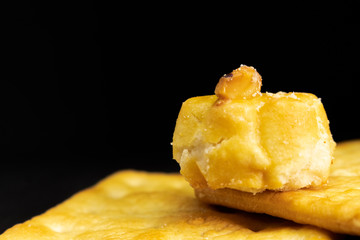 Cracker cookies on dark background.