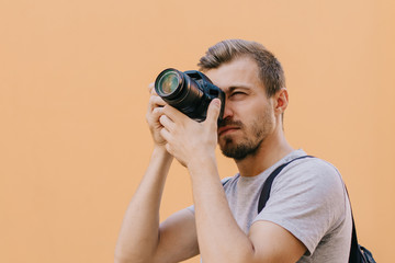 Fototapeta premium Photographer taking photo on dslr camera isolated