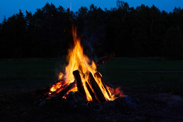 burning bonfire on a summer evening on st.john party