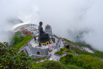 Buddha statue at summit of Fan Si Pan mountain peak the highest Indochina located in Sa Pa Hoang...