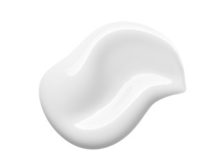 White cosmetic cream lotion swipe isolated on white background. Makeup foundation swatch smear smudge. BB, CC cream texture