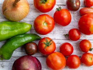 Variety of fresh vegetables on wooden surface