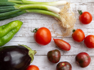 Variety of fresh vegetables on wooden surface