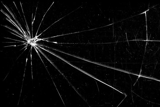 cracked glass isolated on a black background. broken glass