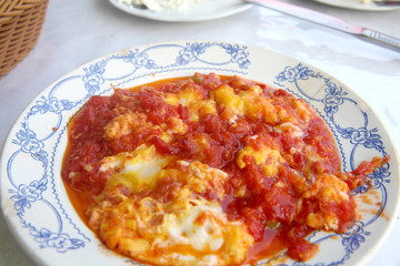 Traditional turkish food menemen made by eggs and tomatoes. 