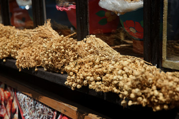 Fototapeta na wymiar Dried Peganum harmala(uzerlik) are hung in homes to protect against 