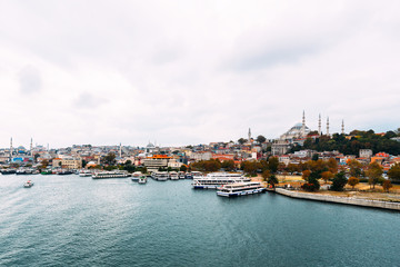 Fototapeta na wymiar City Istanbul. Istanbul daytime landscape. View of the city. Galata Tower, Galata Bridge, Karakoy district and Golden Horn at daytime.