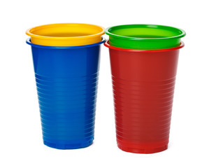 Colored plastic cups isolated on white background