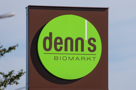 Stade, Germany - August 22, 2019: Signage on pole iddentifying a denn&rsquo;s Biomarkt store. denn&rsquo;s is a brand of Dennree Gruppe seated in T&ouml;pen, Germany