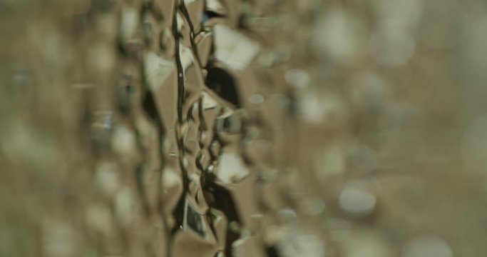 a camera pan of a shattered plastic structure with a small depth of field.
