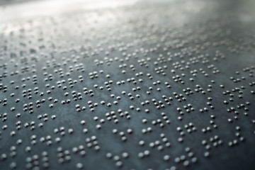 Braille alphabet on metal plate