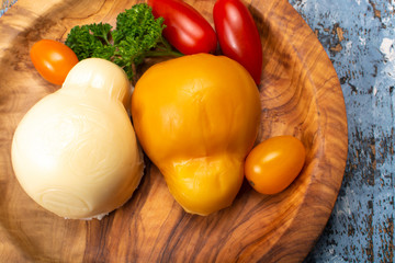 White and smoked yellow italian scamorza cheese