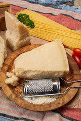 Cooking with hard italian cheese, grated parmesan or grana padano cheese