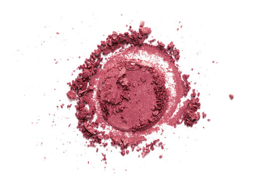 Blush, eye shadow crushed swatch isolated on white background. Pink makeup face powder texture