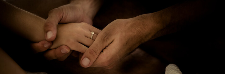 Close up of caucasian couple hands with wedding relationship ring have love together forever -...