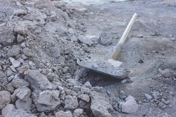 construction work shovel and dirty earth