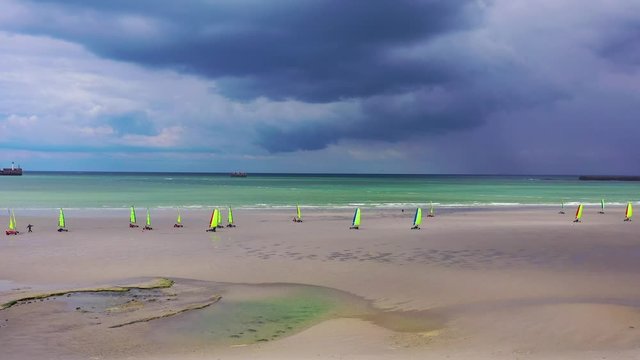 Aerial land carts sail carts blokarts sand yachts are sailed on the beach in France.