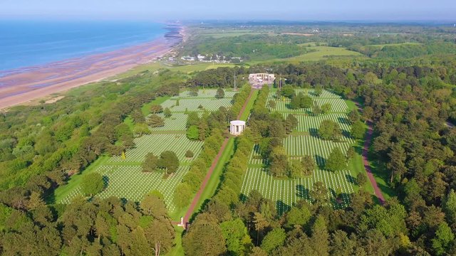 Aerial over vast American World War Two cemetery memorial at Omaha Beach, Normandy, France.