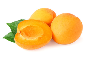 apricot fruits with slices and green leaf isolated on white background.