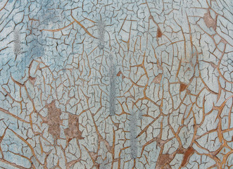 Cracked paint on wooden background, texture. Vintage wallpaper