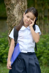 Thoughtful Female Student With Notebooks