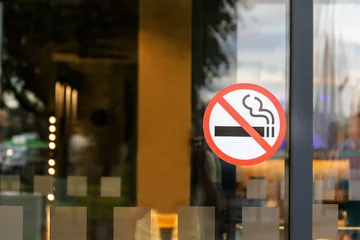 no smoking sticker on the door © Sergey