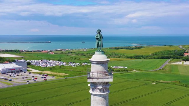 Aerial around Napoleon Bonaparte statue in Boulogne-sur-Mer France, looking across English Channel towards Great Britain.