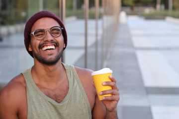 Handsome ethnic young male smiling outdoors