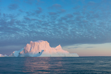 Huge icebergs of different forms in the Disko Bay, West Greenland. Their source is by the...