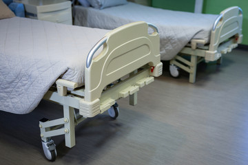Row of empty hospital beds 