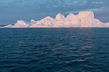 Huge icebergs of different forms in the Disko Bay, West Greenland. Their source is by the...