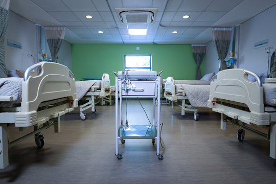 Endoscopy cart machine with empty beds in row at hospital ward