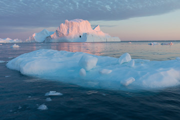 Huge icebergs of different forms in the Disko Bay, West Greenland. Their source is by the...