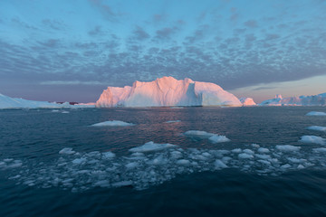 Huge icebergs of different forms in the Disko Bay, West Greenland. Their source is by the...