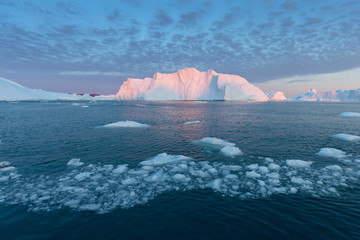 Huge icebergs of different forms in the Disko Bay, West Greenland. Their source is by the...