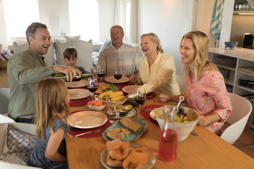 Family having meal on dining table