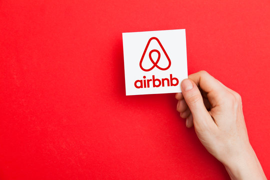 LONDON, UK - May 7th 2017: Hand holding Airbnb logo. Airbnb is a popular online home vacation rental company
