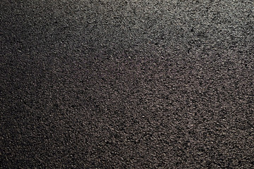 wet asphalt road with sunny texture