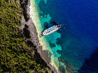 Boat with tourists on a Porto Katsiki beach, on Popular Greece island - Lefkada. Aerial view.