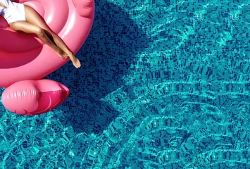Gordijnen Summer vibes tourist vacation mood concept. Top view. Beautiful  woman legs relaxing on pink flamingo float © Dmitry Lobanov